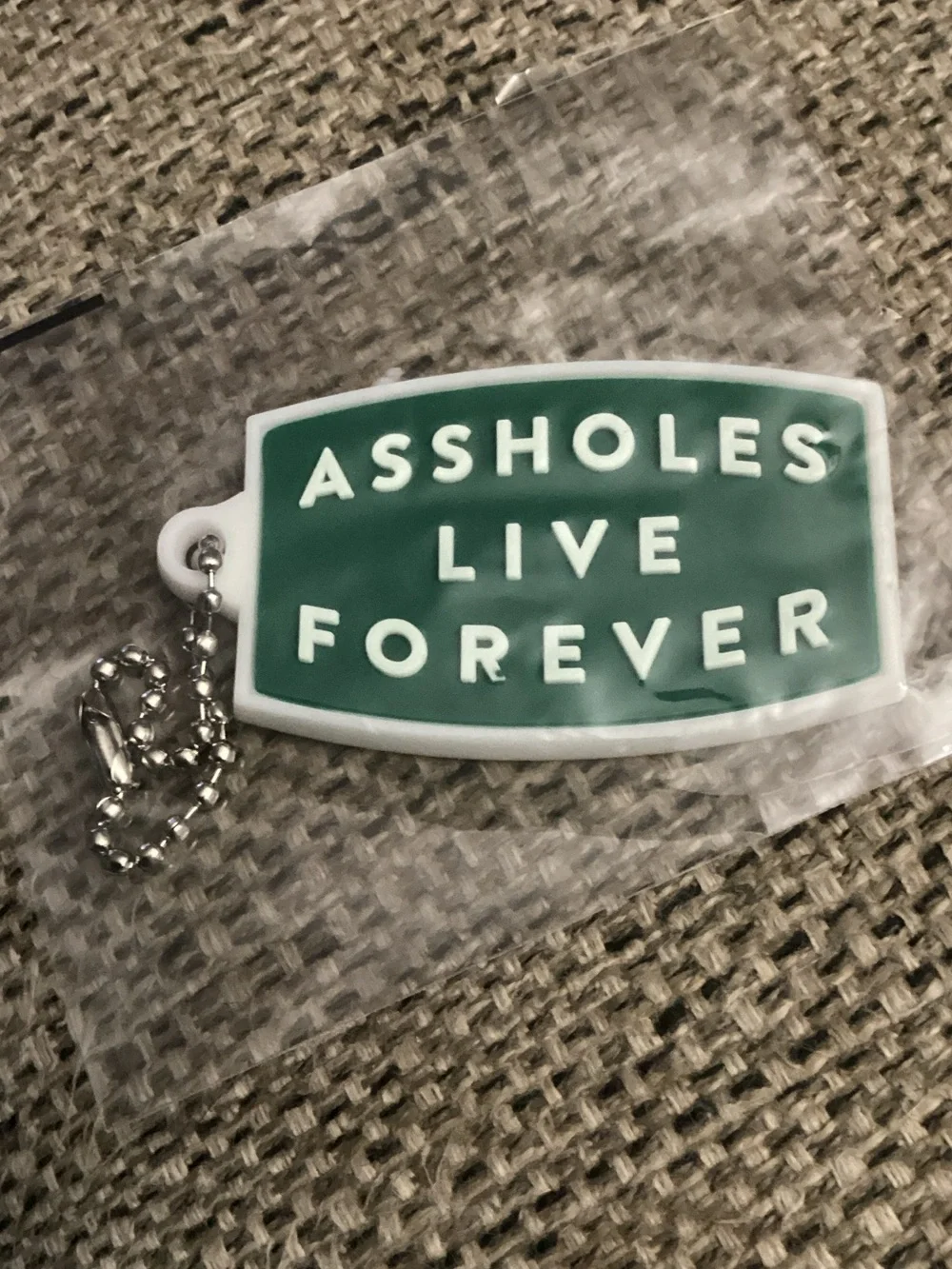 Green Novelty Keychain Tag - 'Assholes Live Forever'